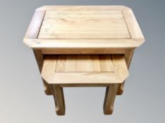 A nest of two contemporary oak tables