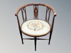 A late 19th century beech framed elbow chair with tapestry seat