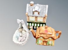 A Lladro figure of two babies sleeping in a crib together with a cottage ware teapot and biscuit