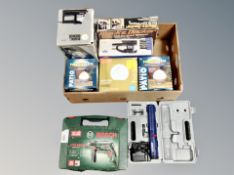 A box of boxed and cased power tools including Bosch PSV 650 RE corded electric impact drill,