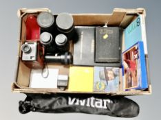 A box of camera equipment, Vivitar camera tripod in bag, books, lenses,