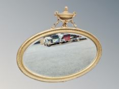 A 19th century gilt gesso oval bevel edged mirror,