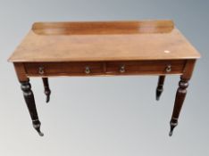 A Victorian mahogany side table fitted with two drawers