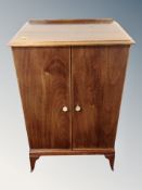 A mahogany music cabinet fitted with six drawers