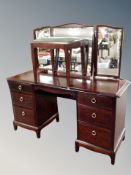 A Stag Minstrel six drawer kneehole dressing table with triple mirror and stool