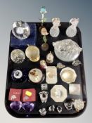 A tray of glass and crystal ornaments, paperweights, desk clock,