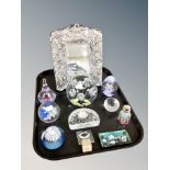 A tray of glass paperweights, decorative easel mirror,