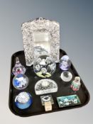 A tray of glass paperweights, decorative easel mirror,