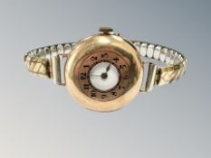 A 9ct gold lady's wristwatch on plated expanding strap