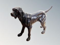 A painted bronze figure of a spaniel