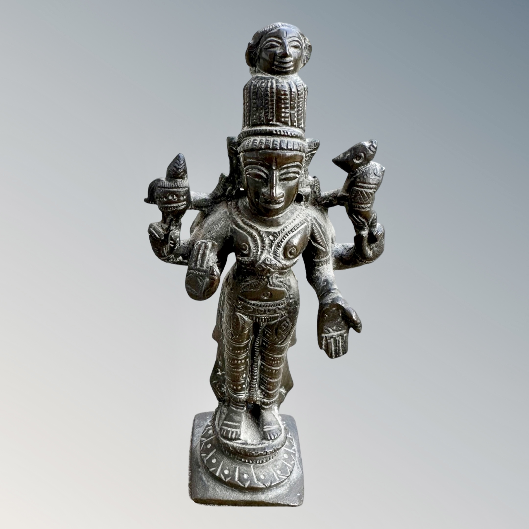 A 19th century Indian bronze devotional deity figure, height 14.