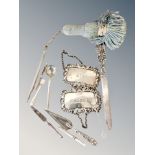 A collection of silver items ; letter opener, decanter labels, book mark in the form of a trowel,