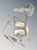 A collection of silver items ; letter opener, decanter labels, book mark in the form of a trowel,