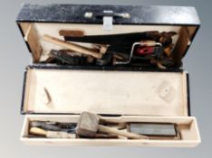 A vintage painted pine joiner's tools box containing hand tools, saws, woodworking planes,