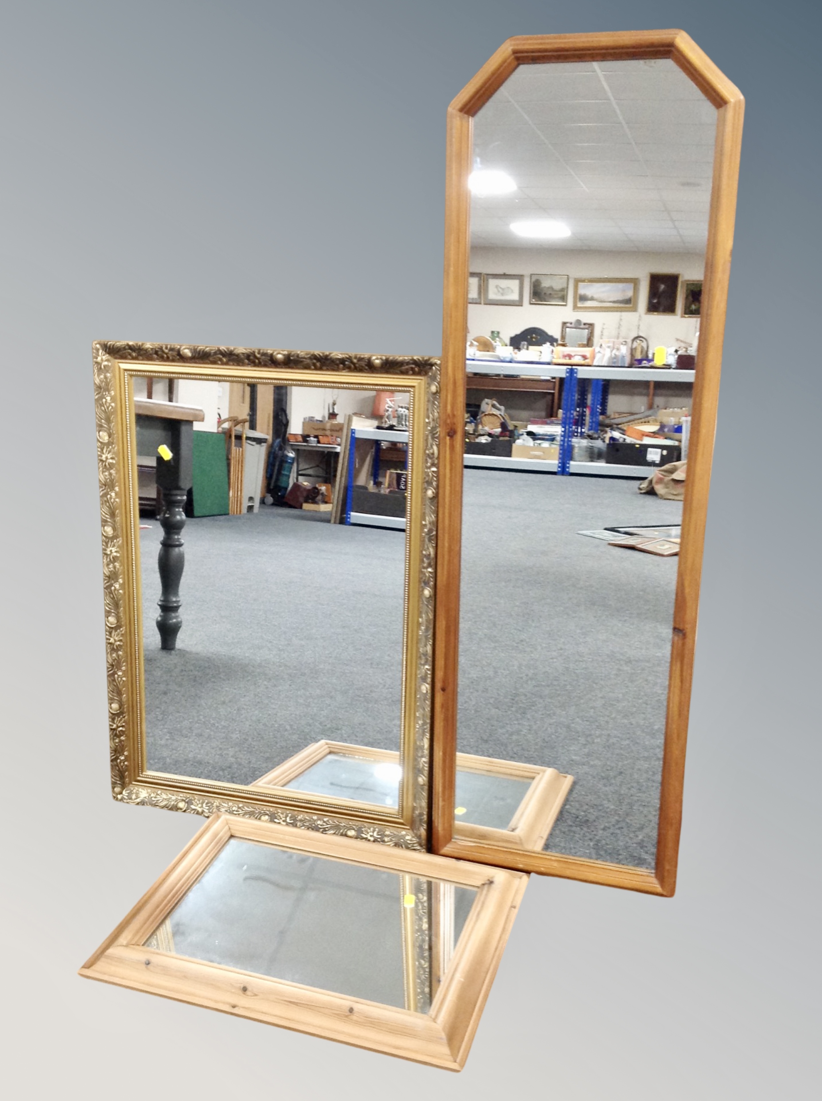 A classical gilt framed mirror together with two pine framed mirrors