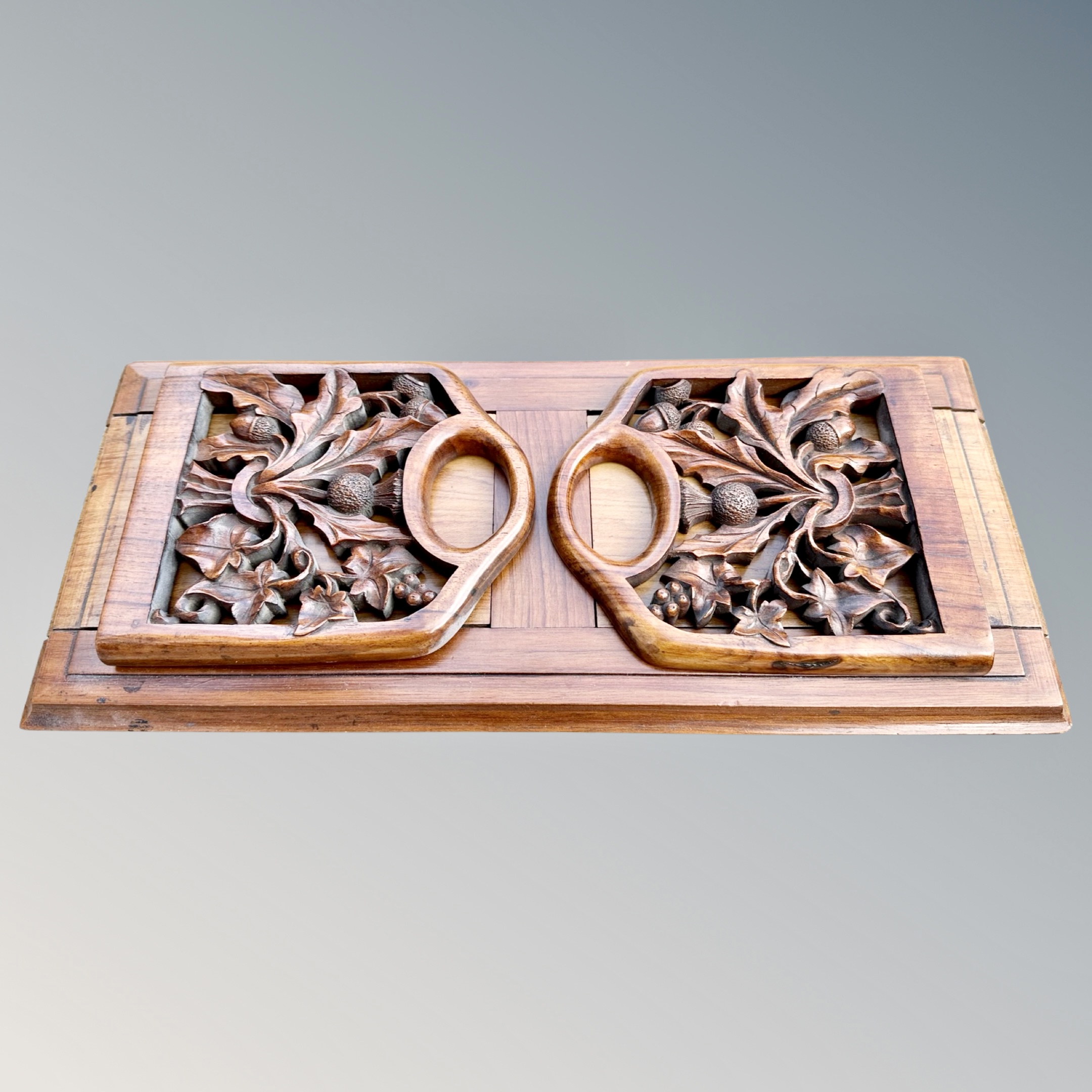 A Victorian Scottish walnut book slide, the carved end panels depicting thistles, - Image 2 of 2