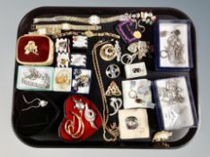 A tray of costume jewellery, wristwatches, bracelets, brooches,