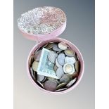 A pot containing world coins (Q)