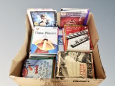 A box of music books and sheet music