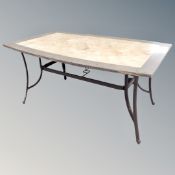 A faux marble topped garden table on metal legs