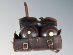 A pair of early 20th century Thomas Taylor of Glasgow lawn bowls in stitched leather case