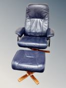 A Scandinavian blue leather swivel relaxer chair and stool