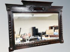 An Edwardian oak framed mirror