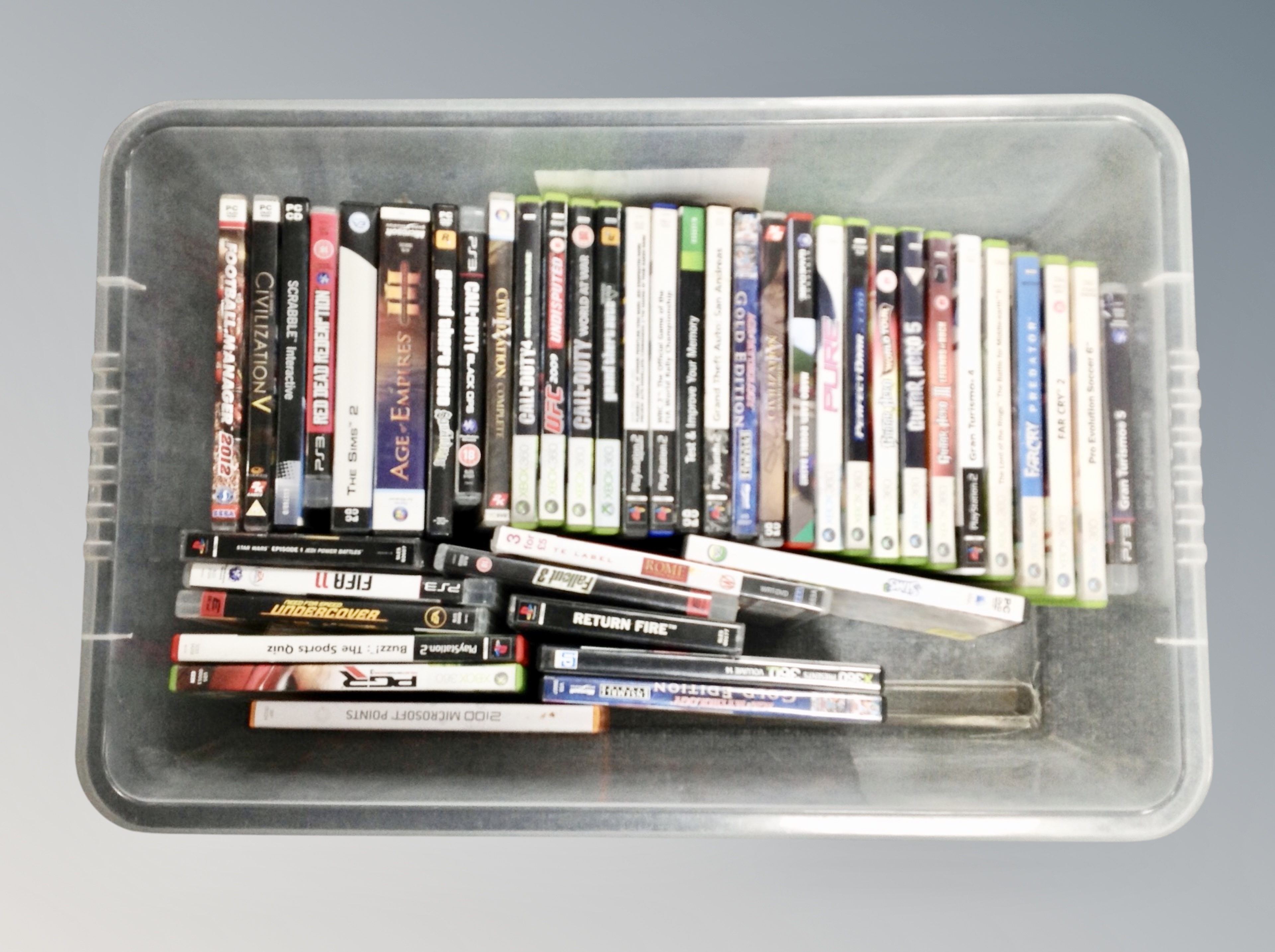A box of Playstation II, III,