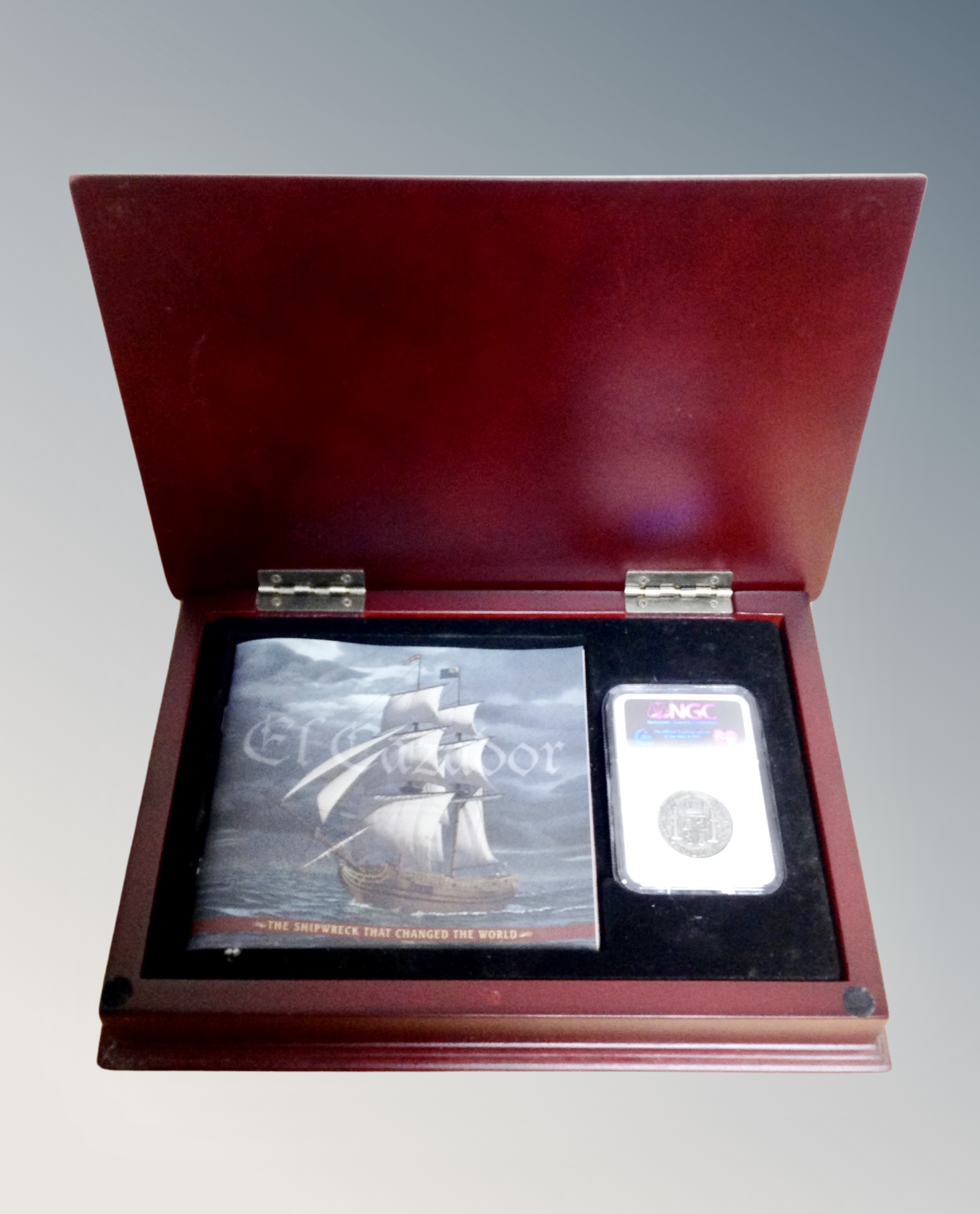 An El Cazador The Shipwreck that Changed the World coin and booklet in box