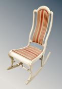 A vintage painted Scandinavian rocking chair