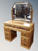 A 1920's oak twin pedestal knee hole dressing table