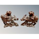 A pair of Chinese hardwood carvings of figures astride water buffaloes, height 17.