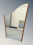 A 20th century harp-shaped teak mirror,