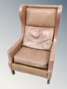 A Danish brown leather wingback armchair