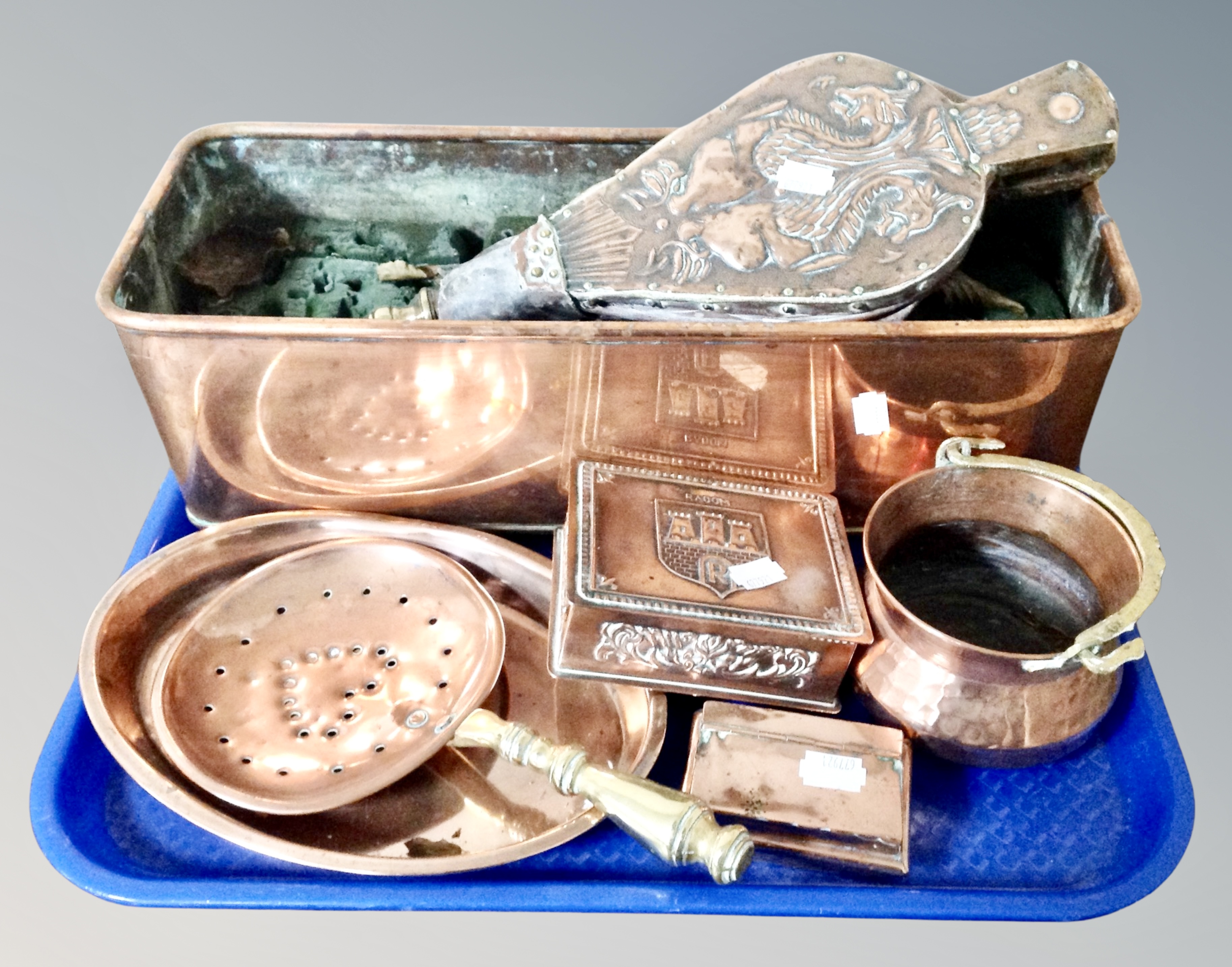 A tray of antique and later copper ware, trough, table boxes, miniature chestnut roaster,