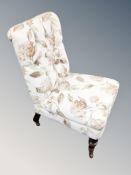 A Victorian mahogany bedroom chair in floral buttoned fabric