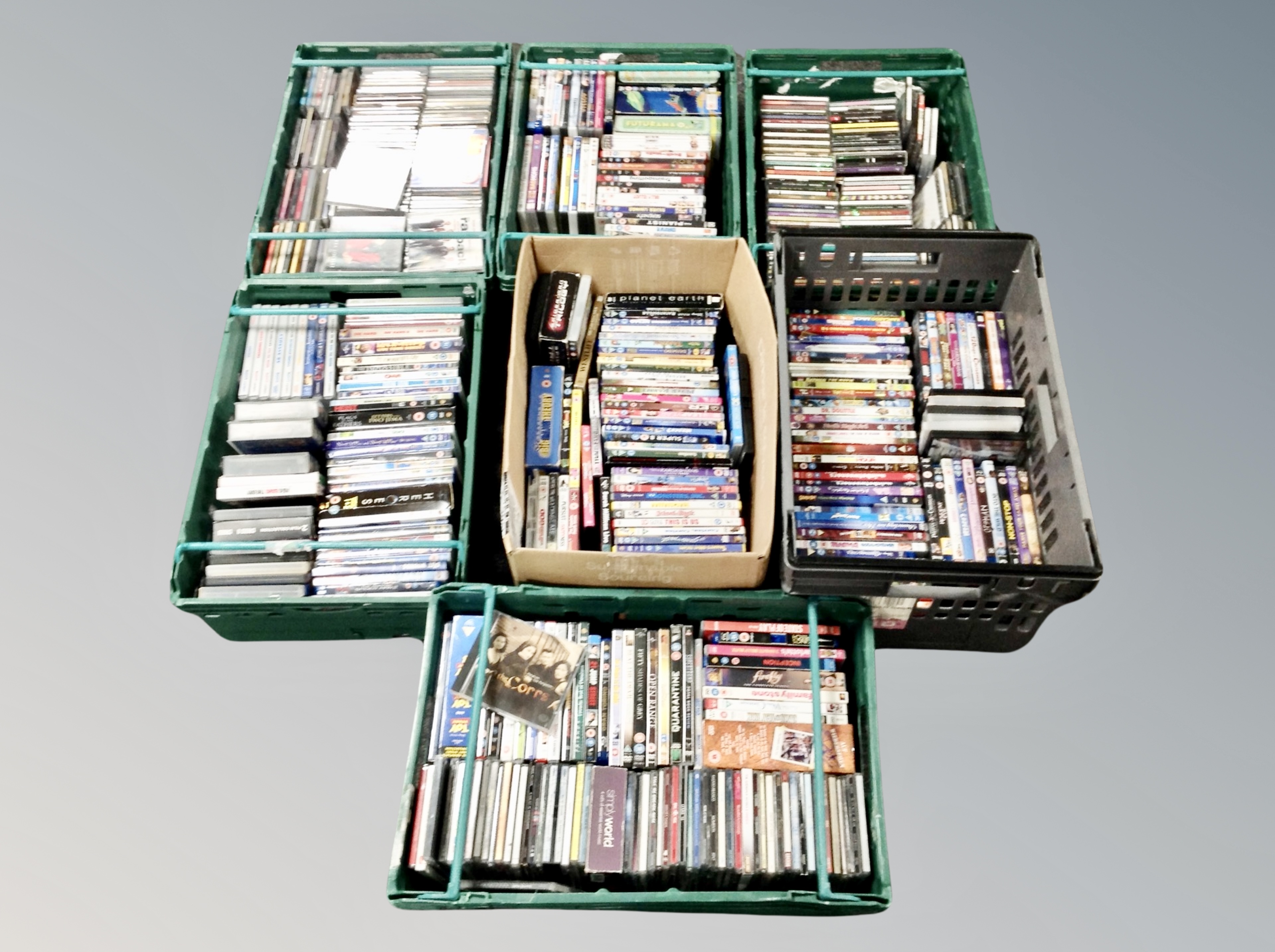 A box and six crates of DVDs and CDs