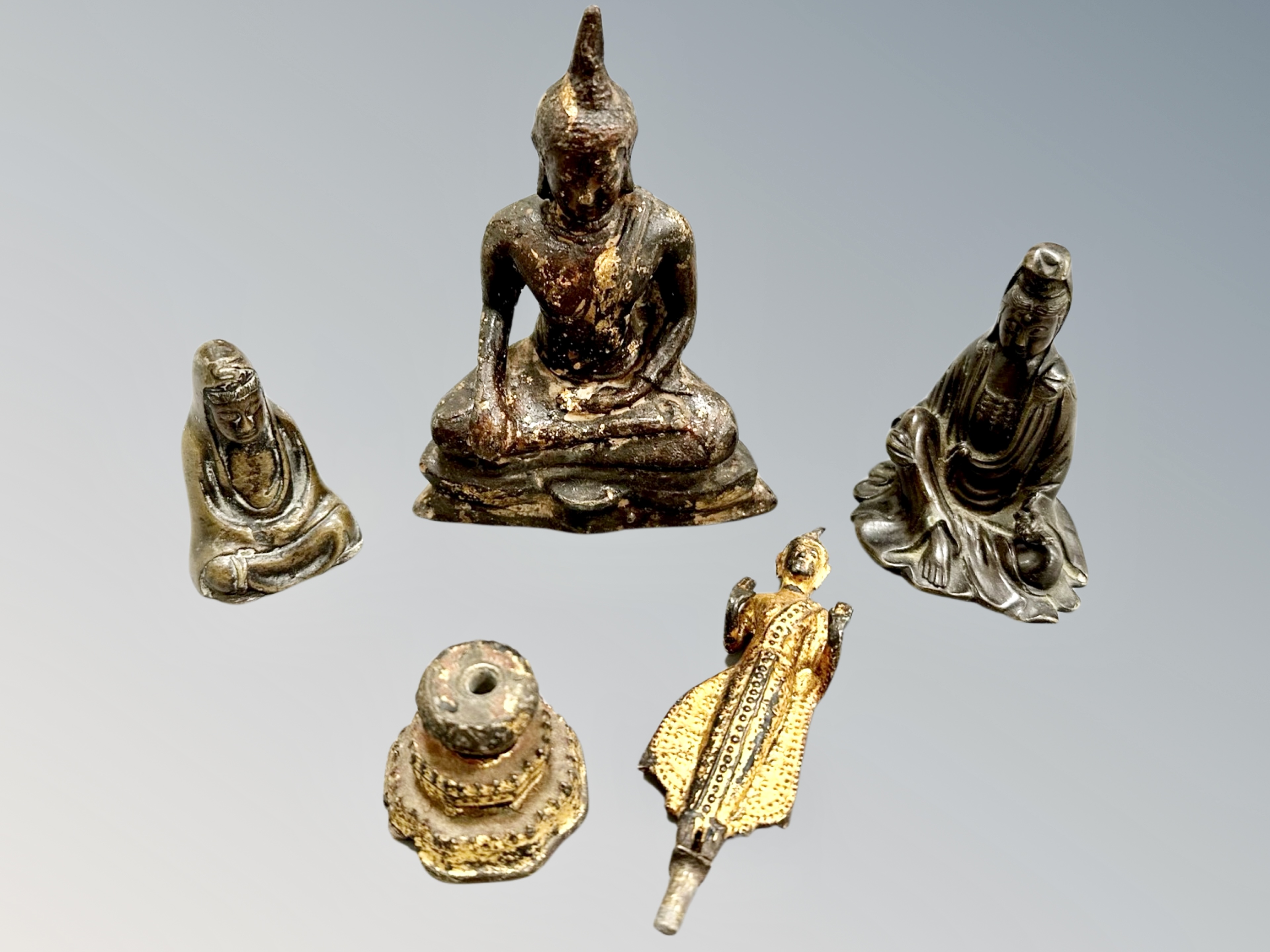 A 19th century Thai gilt metal seated Buddha and thre further Thai/Chinese figures