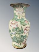 A Japanese glazed earthenware vase depicting birds in foliage,