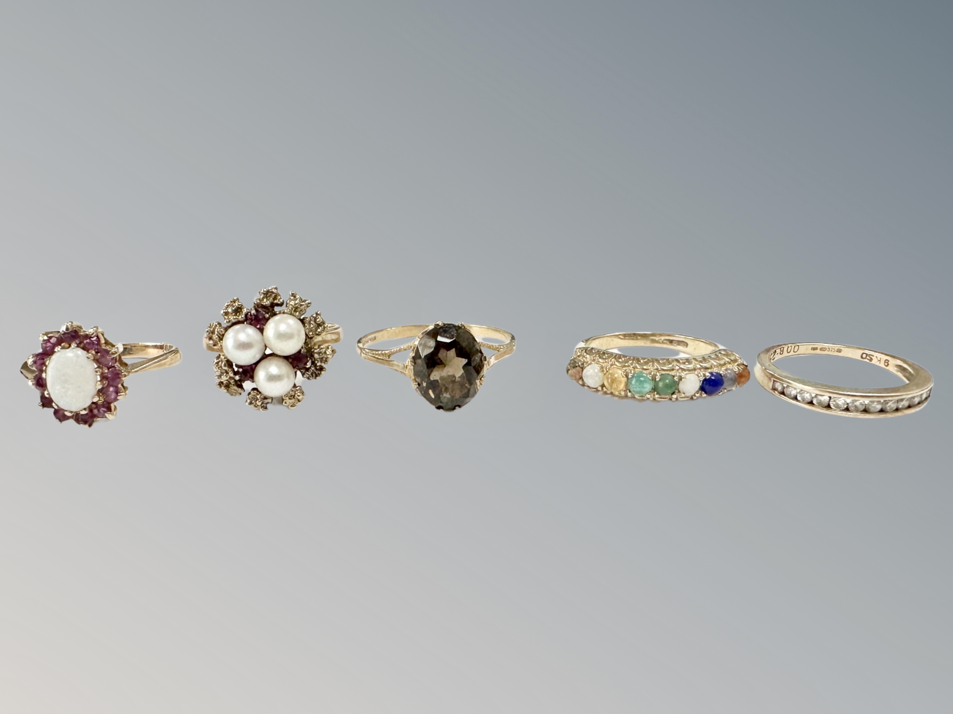 Five 9ct gold rings, variously set with gemstones CONDITION REPORT: 13.5g gross.