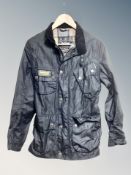 A Barbour International wax jacket size S