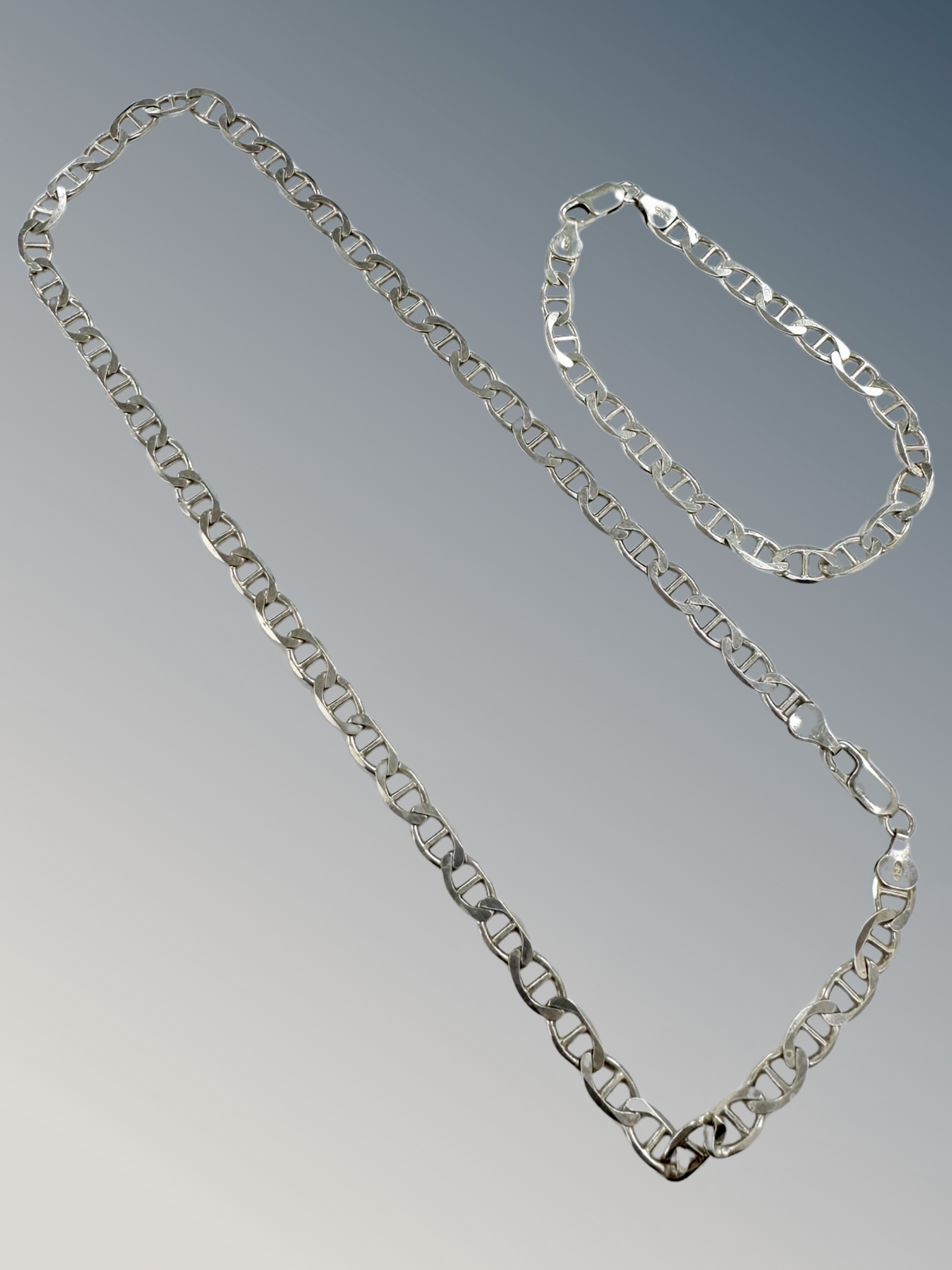A silver flat link necklace and matching bracelet CONDITION REPORT: 27.