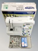 A Brother LS 14S compact electric sewing machine and a sewing machine accessory kit