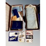 A collection of Masonic memorabilia, two cases, booklets, lodge sash,