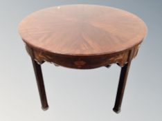 A 19th century inlaid mahogany circular centre table