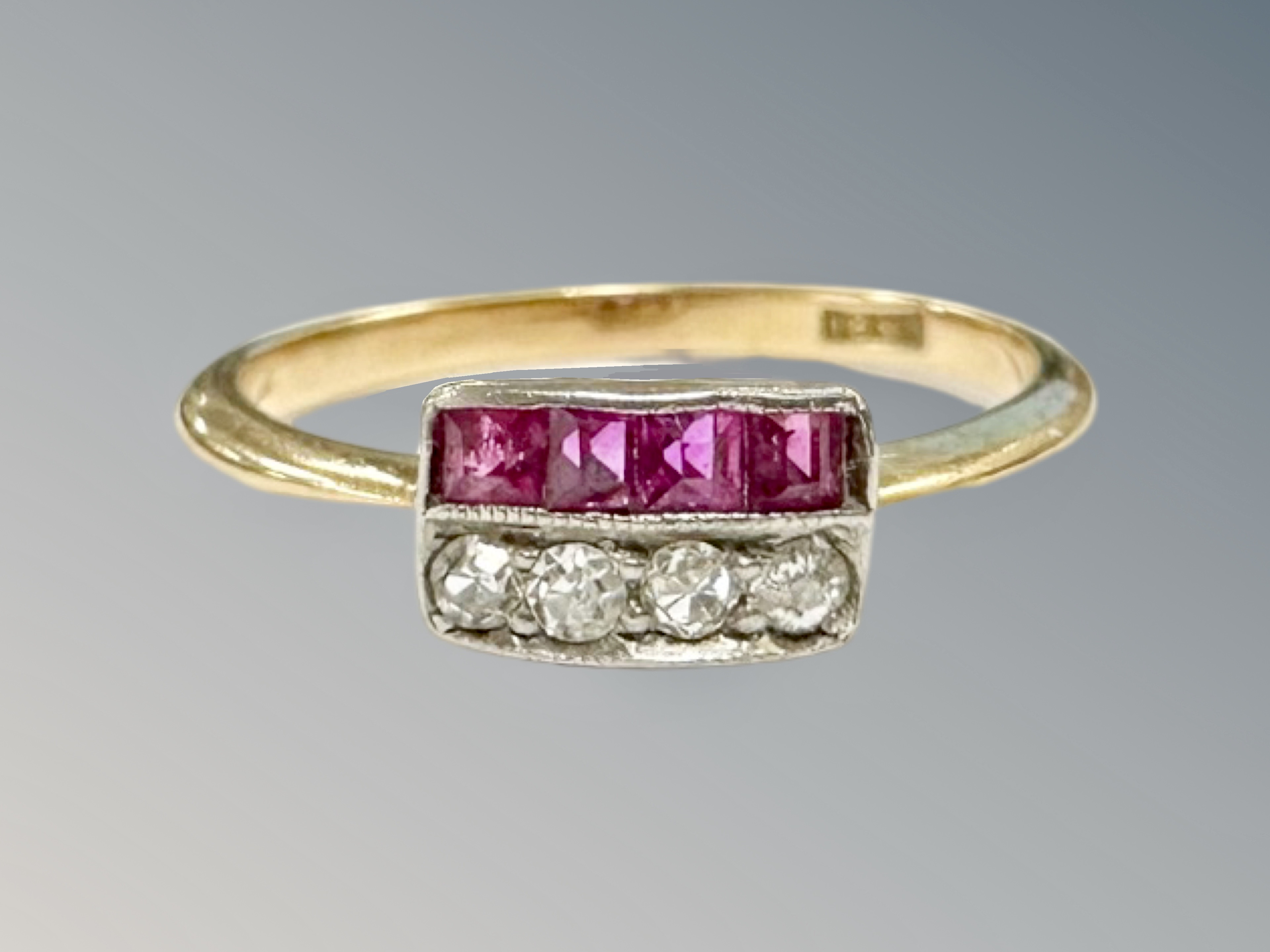 An 18ct gold ruby and diamond ring, size M CONDITION REPORT: 1.