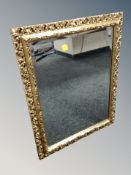 A decorative gilt framed bevelled mirror