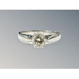A platinum diamond solitaire ring, the brilliant-cut stone weighing approximately 0.