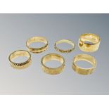 Six brass sample wedding bands