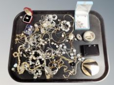 A tray of costume jewellery, necklaces, bracelets.